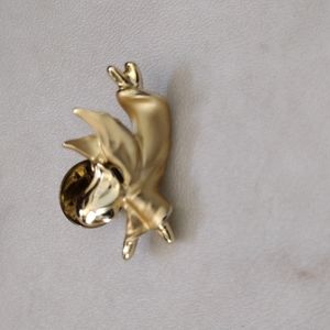 Gigi lapel pin.